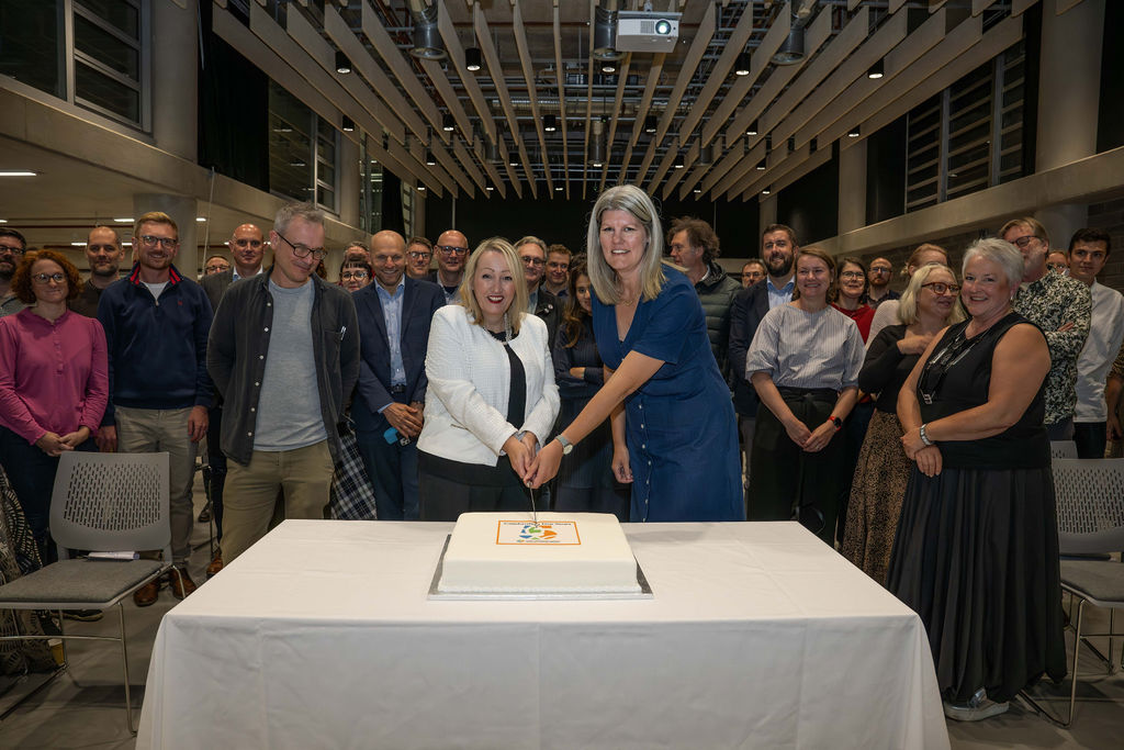 Cutting celebratory cake